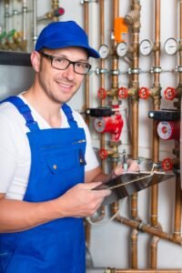 plumber checking another manifold